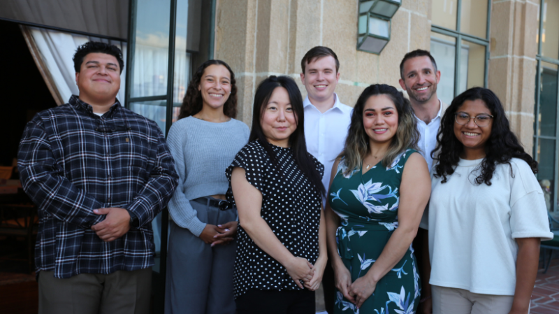Seven Academy students smiling at camara