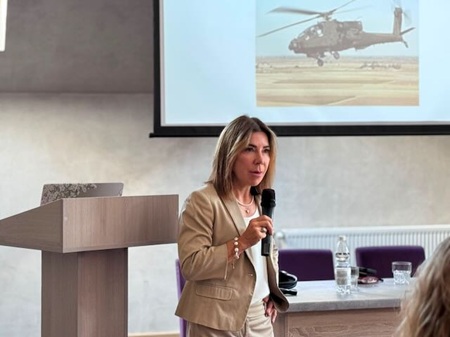 Prof. VanLandingham speaking at podium at the law of war accountability conference&nbsp;in the Carpathian Mountains of Ukraine.