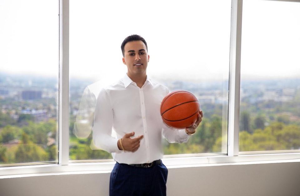 Nima Namakian holding basketball