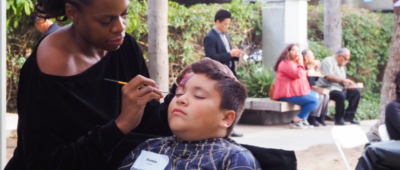 A child getting their face painted