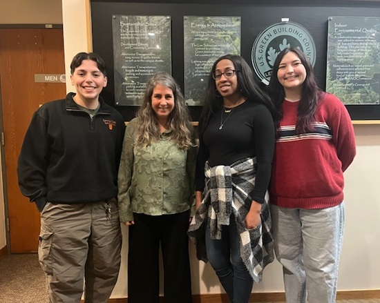 Prof. Andrea Freeman with three Lewis and Clark students