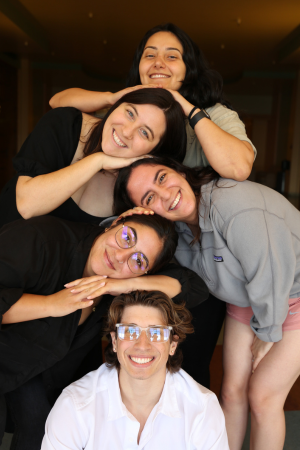 Five SCALE students smiling while posing with their heads stacked on top one another