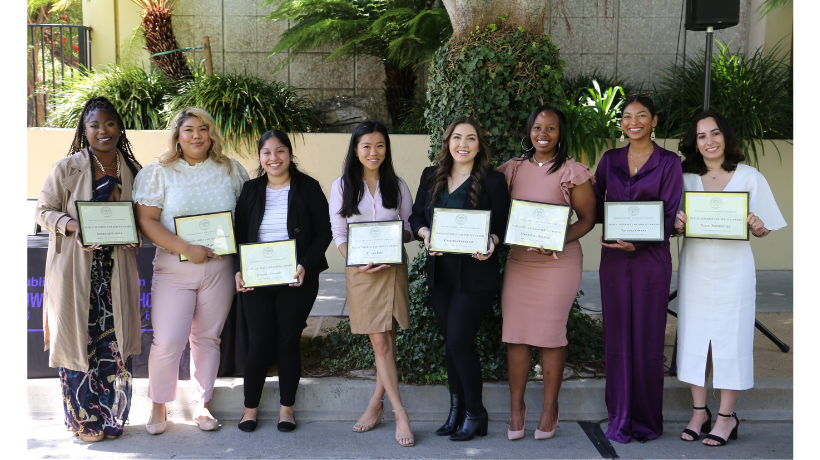 Angel Ajala, Fabiola Martinez, Jovana Morales, Vivian Kim, Cristina Terrazas, Markisha Roches, Tatiana Owens, and Eleni Rodriguez standing in a line holding their award certificates