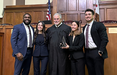 Chinonso Anokwute, Julianna Montano, David Olmedo-Barrera, and Natalie Parsi with Judge at competition