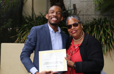 Donald Bullock holding his award with Prof. Gunning